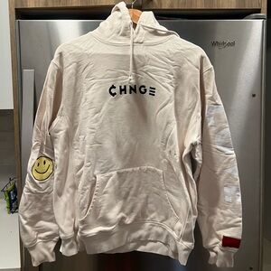 CHNGE Cream Hoodie with Black Logo and Yellow Smiley